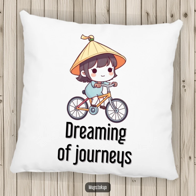 Funny pillow featuring a cute character with a tiny Japanese hat, happily riding a bike, providing comfort and travel-themed charm.