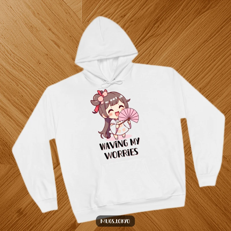 Funny hoodie depicting an excited character with a big smile, waving an oversized fan in a comical manner.