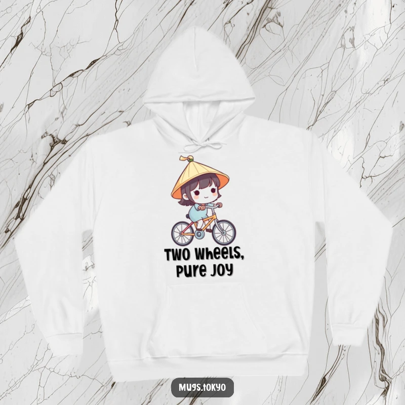 Funny hoodie featuring a cute character with a tiny Japanese hat, happily riding a bike, offering warmth and travel-themed charm.