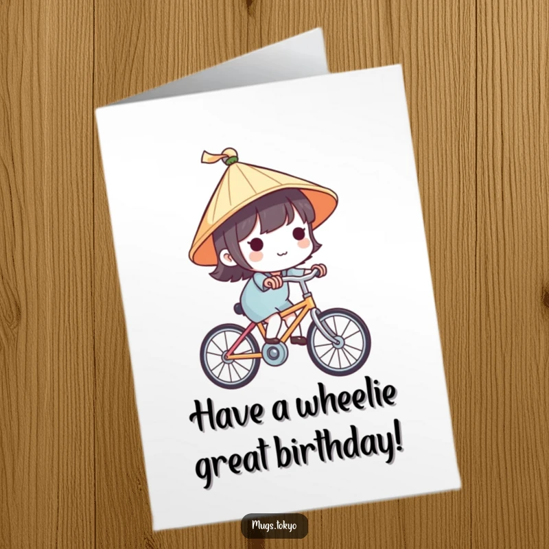 Cute free printable birthday card showing a character in a tiny traditional Japanese hat happily riding a bicycle, spreading birthday cheer.