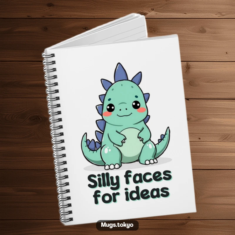 Funny notebook with a character making a silly face to surprise a small Godzilla, ideal for notes.