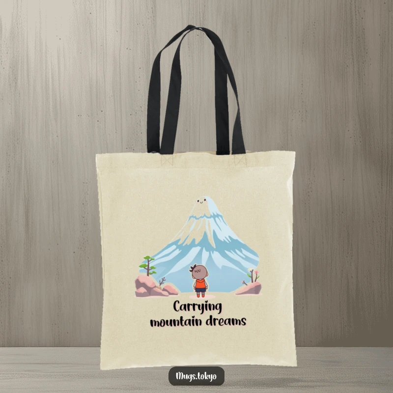 Funny tote bag illustration of a character looking up in wonder at a smiling, whimsical Mount Fuji, perfect for carrying daily items.