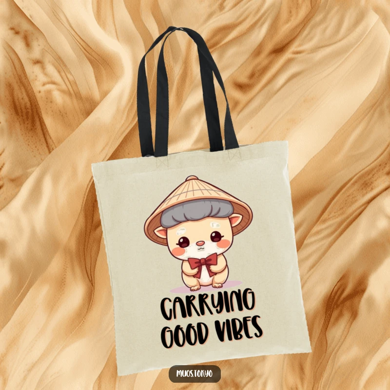 Funny Tote Bag featuring a cute creature in a traditional Japanese hat, bowing shyly, perfect for carrying daily essentials with grace.